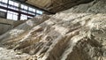 Pile of ammonium sulfate powder inside a warehouse of chemical plant