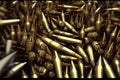 A pile of ammunition for weapons. Cartridges for machine guns and carbines. Background from new shiny cartridges. Neural