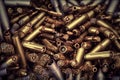 A pile of ammunition for weapons. Cartridges for machine guns and carbines. Background from new shiny cartridges. Neural