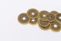 Pile of Ancient Chinese Coins with Square Holes on White Background, Close-Up Royalty Free Stock Photo