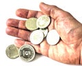 A pile of anniversary coins of republic of Bulgaria in a human`s hand isolated on white background