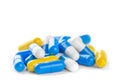 Pile of antibiotic color pills on a white background