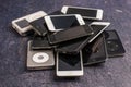 Stack of old iPhones and iPods