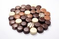 A pile of assorted chocolates on a white surface. Royalty Free Stock Photo