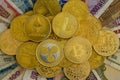 Pile of assorted gold cryptocurrency coins