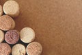 Pile of assorted used wine corks on brown natural craft cork background. Close up top view. Free copy space. Royalty Free Stock Photo