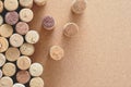 Pile of assorted used wine corks on brown natural craft cork background. Close up top view. Free copy space. Royalty Free Stock Photo