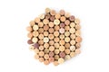 Pile of assorted used wine corks in shape of circle isolated on white background. Close up top view. Royalty Free Stock Photo