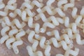 Pile of Authentic Italian Pasta on Wooden Background