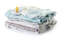Pile of baby clothes isolated on white Royalty Free Stock Photo