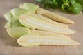 Pile of Baby corn on wood board.