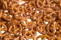 A pile of baked pretzels on white.