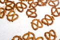 A pile baked pretzels on white.