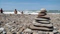Pile of balanced rocks on the rocky shore of a beach Royalty Free Stock Photo