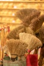 A pile of bamboo brooms in market for sale. Background for texture