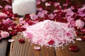 pile of bath salts with dried rose petals on wooden surface Royalty Free Stock Photo