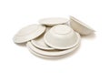 Pile of beige dinner plates, soup plates and sauce Royalty Free Stock Photo