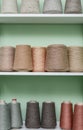 Pile of big colorful spools of yarn on shelving Royalty Free Stock Photo