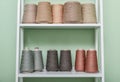 Pile of big colorful spools of yarn on shelving Royalty Free Stock Photo