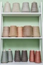 Pile of big colorful spools of yarn on shelving Royalty Free Stock Photo