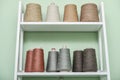 Pile of big colorful spools of yarn on shelving Royalty Free Stock Photo