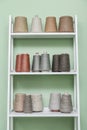 Pile of big colorful spools of yarn on shelving Royalty Free Stock Photo