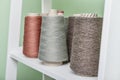 Pile of big colorful spools of yarn on shelving Royalty Free Stock Photo