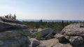 Pile of big rocks from Ochsenkopf Mountain in Fichtelgebirge, Germany with trees on the background