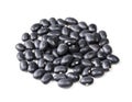 Pile of black mexican beans closeup on white