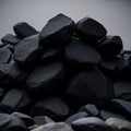Pile of black rocks in gray color background Royalty Free Stock Photo