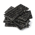 Pile of black sesame snaps on white background close up