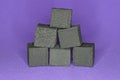 A pile of black square coals for a hookah Royalty Free Stock Photo