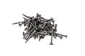 A pile of black steel screws isolated on a white background close up. Royalty Free Stock Photo