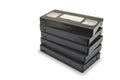 Pile of black vhs videotapes on the white background. Royalty Free Stock Photo