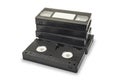 Pile of black vhs videotapes on the white background. Royalty Free Stock Photo