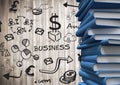 Pile of blue books with black business doodles against blurry wood panel Royalty Free Stock Photo