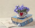Pile of blue books and flowers Royalty Free Stock Photo