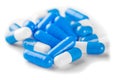 Pile of blue color medical pills on a white background Royalty Free Stock Photo