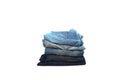 Pile of blue jeans isolated on white background Royalty Free Stock Photo