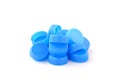 Pile of blue plastic bottle cap on white background Royalty Free Stock Photo