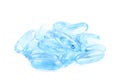 Pile of blue softgel pills isolated