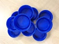 A pile of blue water bottle caps Royalty Free Stock Photo