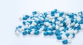 Pile of blue and white capsule pills. Pharmacy product. Prescription drug. Healthcare and medicine. Pharmaceutical industry. Royalty Free Stock Photo