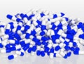 Pile of blue and white pill capsules on white background, 3d rendering