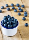 Pile of blueberries in the cup on table fresh fruit background Royalty Free Stock Photo