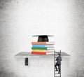 Pile of books and academic hat Royalty Free Stock Photo