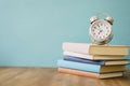 Pile books clock . High quality and resolution beautiful photo concept Royalty Free Stock Photo