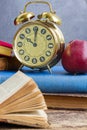 Pile of books with clock Royalty Free Stock Photo