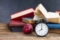 Pile of books with clock Royalty Free Stock Photo