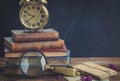 Pile of books with clock Royalty Free Stock Photo